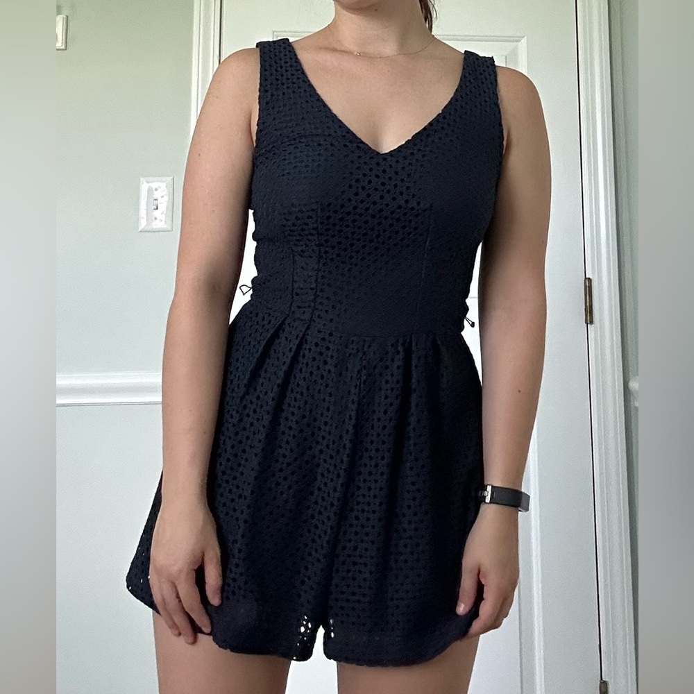 Navy V-neck romper with removable belt. Size 1